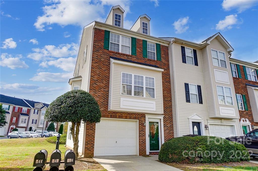 144 Rock Ridge Lane Mount Holly, NC 28120 - Photo 2 of 48 a front view of a building with a garden