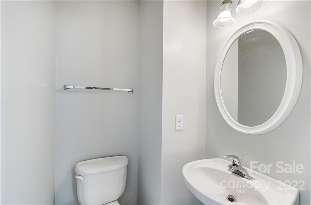 144 Rock Ridge Lane Mount Holly, NC 28120 - Photo 22 of 48 a bathroom with a toilet and a sink
