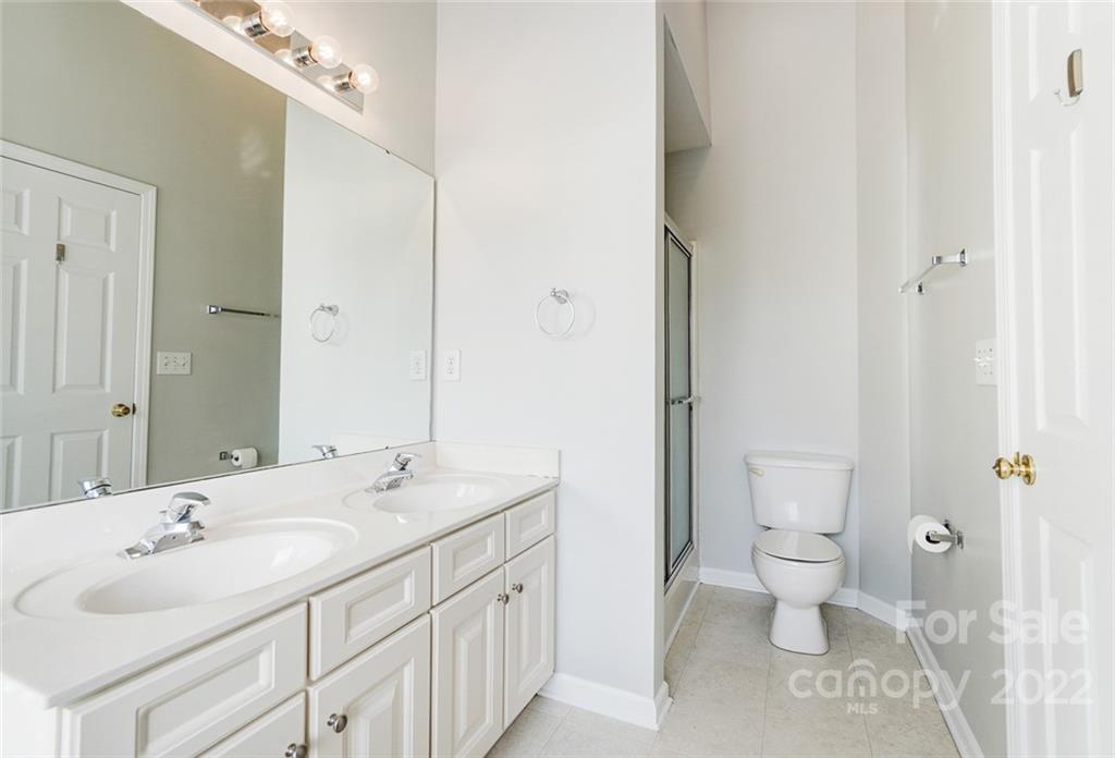144 Rock Ridge Lane Mount Holly, NC 28120 - Photo 27 of 48 a bathroom with a sink and a mirror