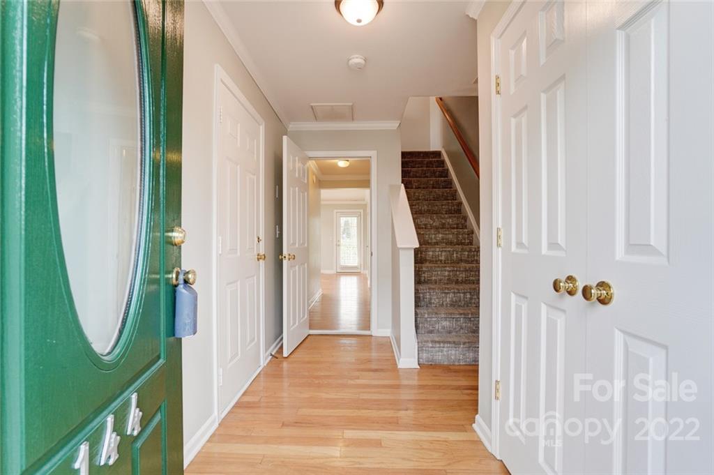 144 Rock Ridge Lane Mount Holly, NC 28120 - Photo 3 of 48 a view of a hallway with wooden floor and entryway
