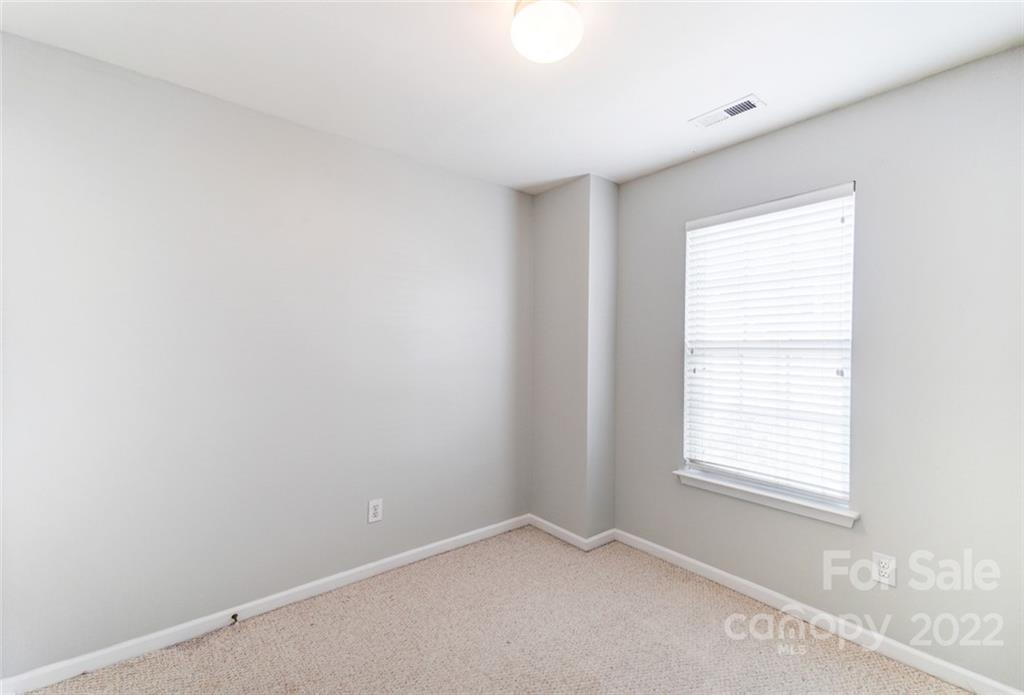 144 Rock Ridge Lane Mount Holly, NC 28120 - Photo 36 of 48 an empty room with windows