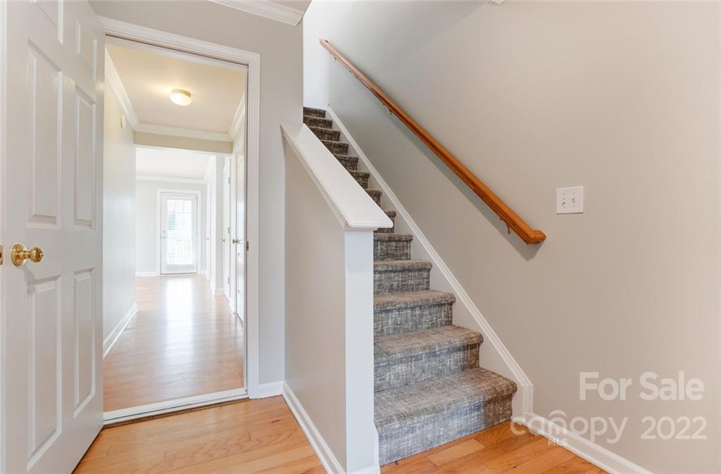 144 Rock Ridge Lane Mount Holly, NC 28120 - Photo 4 of 48 a view of a hallway with wooden floor and staircase