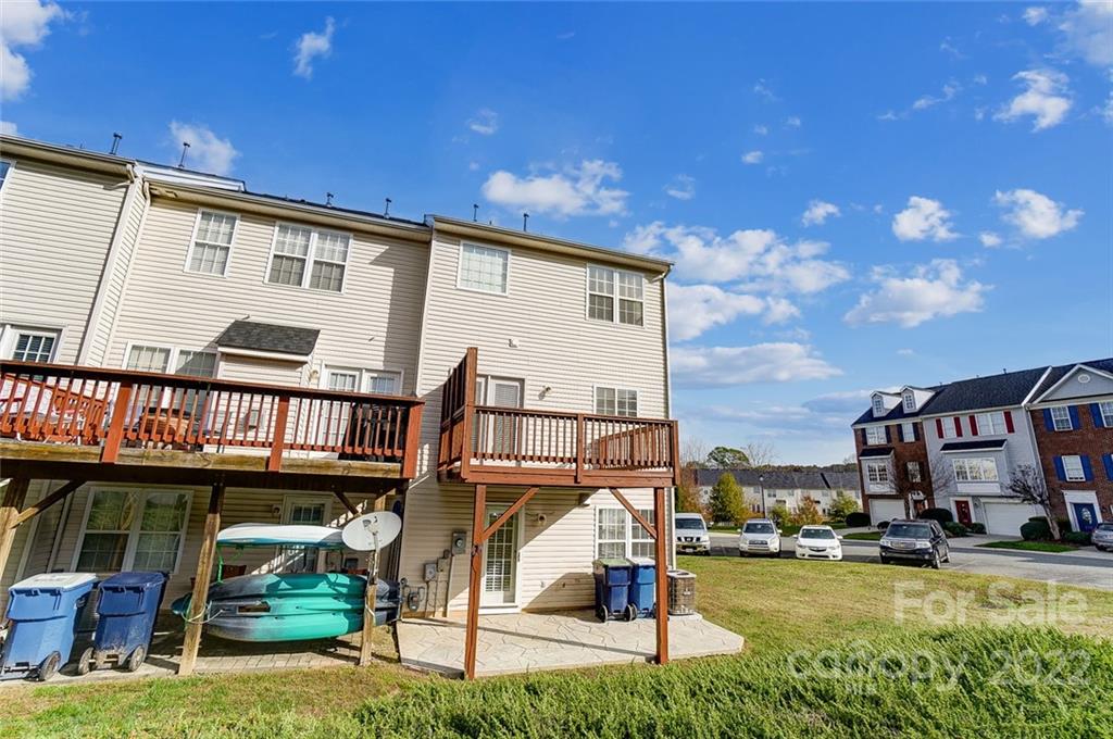 144 Rock Ridge Lane Mount Holly, NC 28120 - Photo 45 of 48 a view of a swimming pool with a patio and a yard