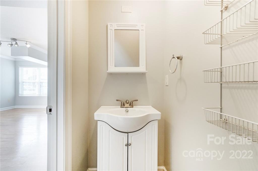 144 Rock Ridge Lane Mount Holly, NC 28120 - Photo 8 of 48 a bathroom with a sink a toilet and a mirror
