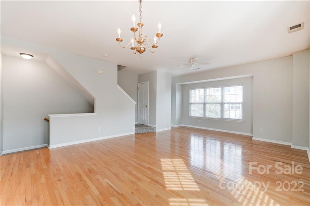 144 Rock Ridge Lane Mount Holly, NC 28120 - Photo 9 of 48 a view of an empty room with wooden floor and a window