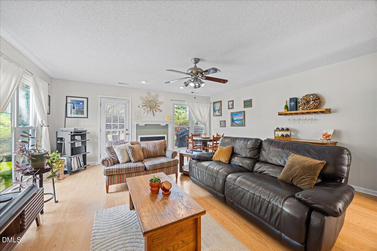 501 Darby Glen Lane Durham, NC 27713 - Photo 11 of 25 a living room with furniture and a wooden floor
