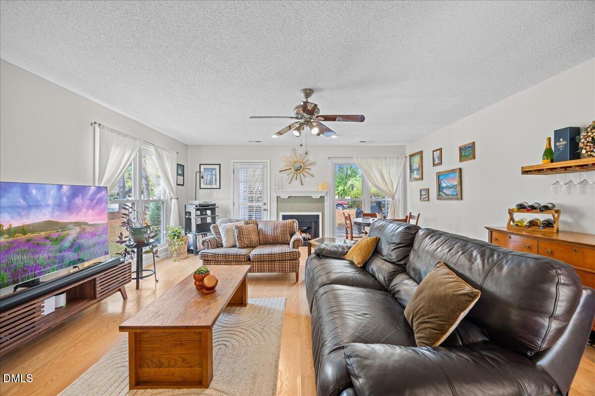 501 Darby Glen Lane Durham, NC 27713 - Photo 12 of 25 a living room with furniture and a flat screen tv