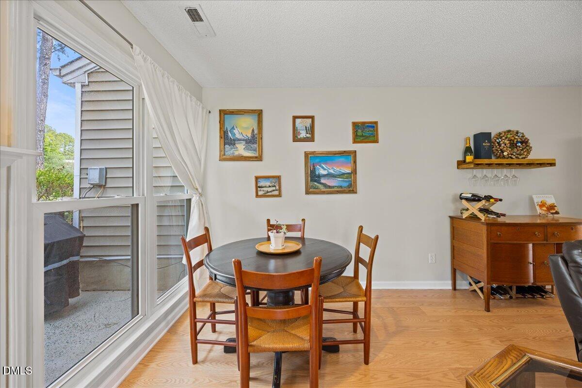 501 Darby Glen Lane Durham, NC 27713 - Photo 14 of 25 a dining room with furniture and a window