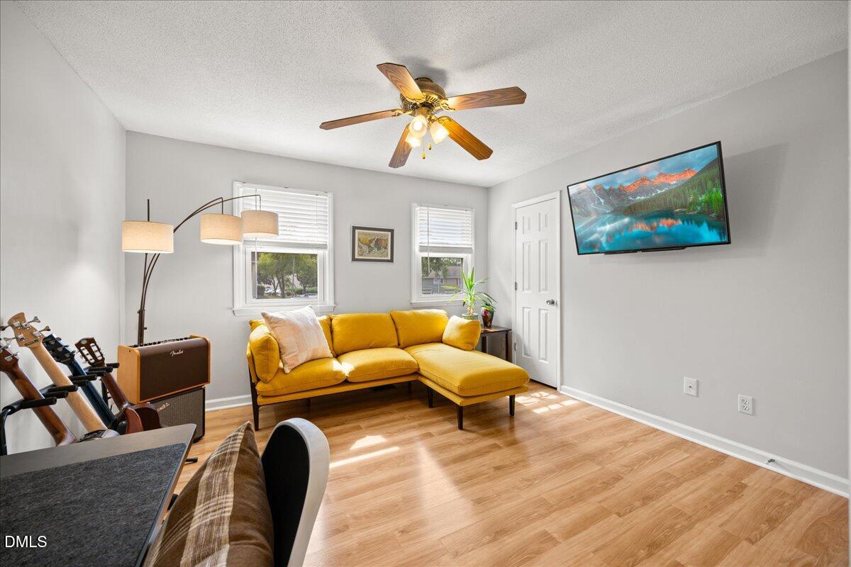 501 Darby Glen Lane Durham, NC 27713 - Photo 19 of 25 a living room with furniture and a large window