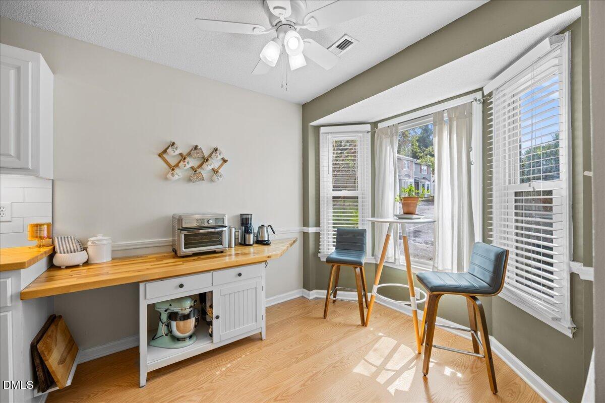 501 Darby Glen Lane Durham, NC 27713 - Photo 4 of 25 a view of a dining room with furniture and a chandelier