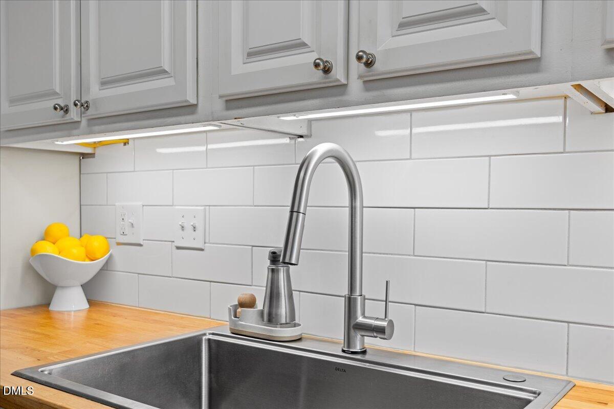 501 Darby Glen Lane Durham, NC 27713 - Photo 8 of 25 a kitchen with a sink and a window