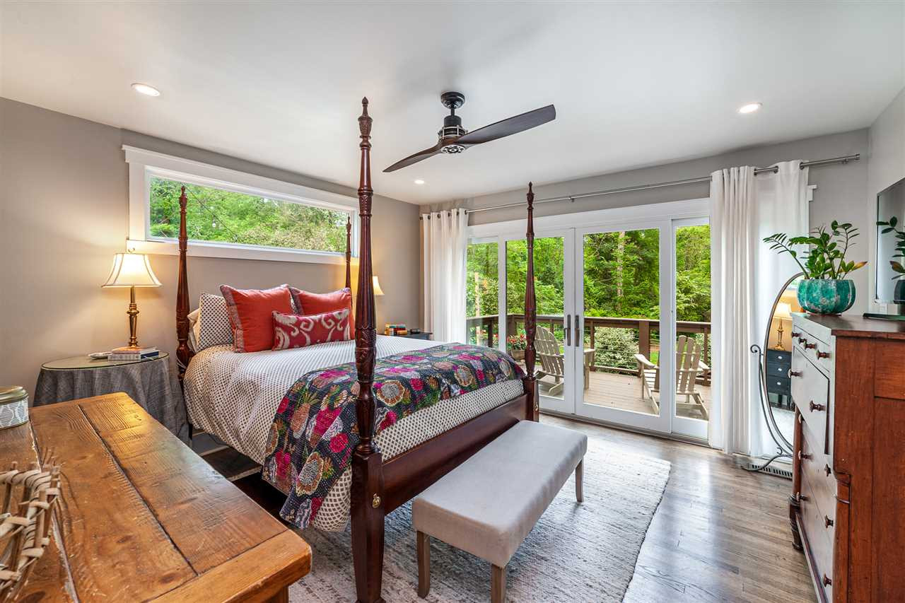 2251 Cranford Road Durham, NC 27705 - Photo 15 of 30 The luxurious main level Master Bedroom Ensuite has sliding glass doors leading out to the private backyard deck. Master Bedroom Ensuite