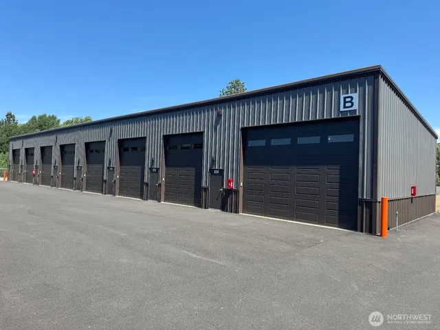 a view of an house with garage and large window