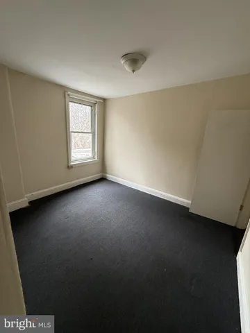 a bathroom with a bathtub and a toilet