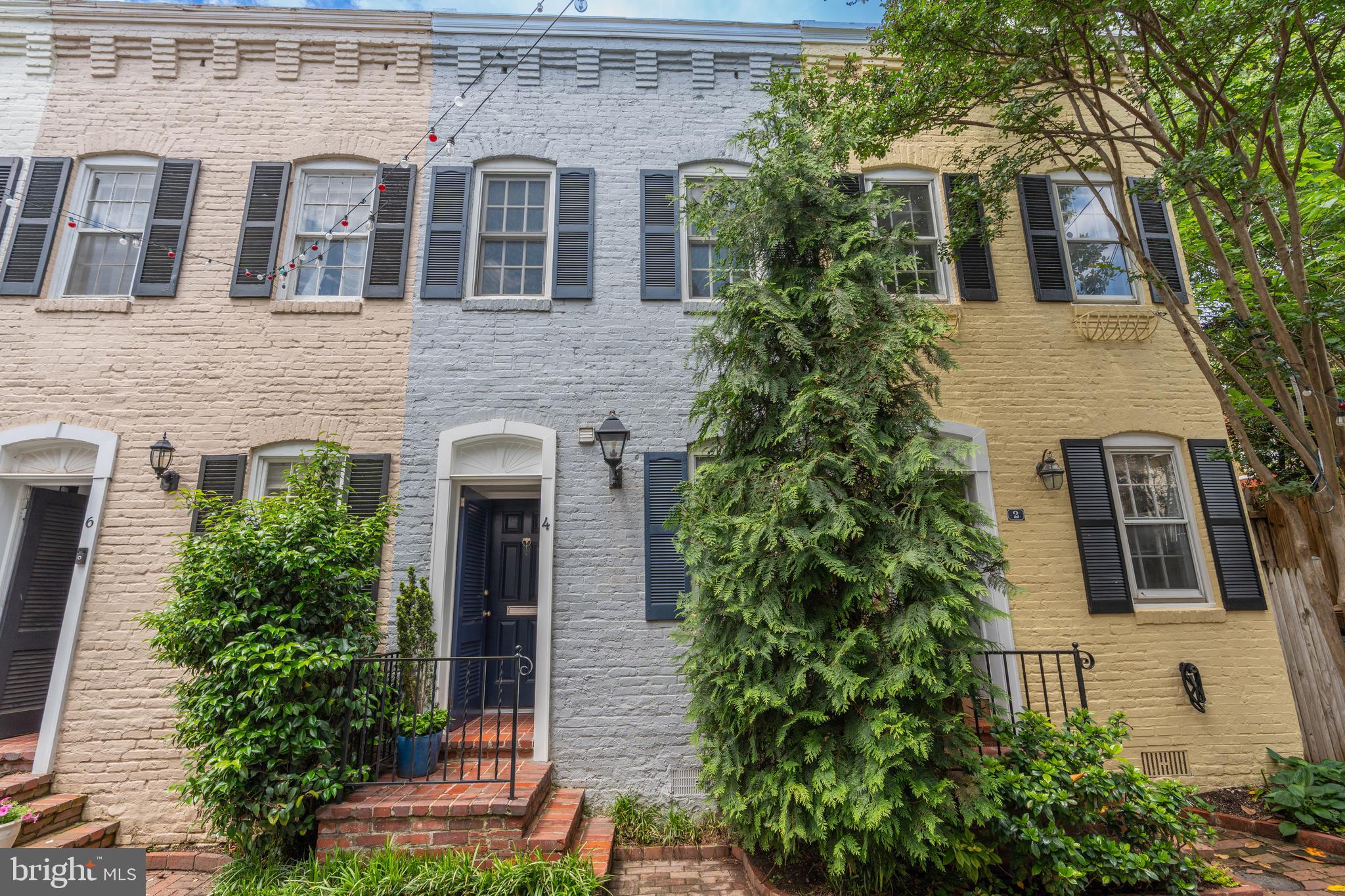 4 Pomander Walk Northwest Washington, DC 20007 - Photo 1 of 24 front view of a house with a tree