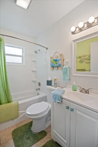 a bedroom with a bed and dresser