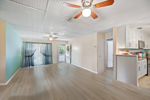 a kitchen with a sink and a stove top oven