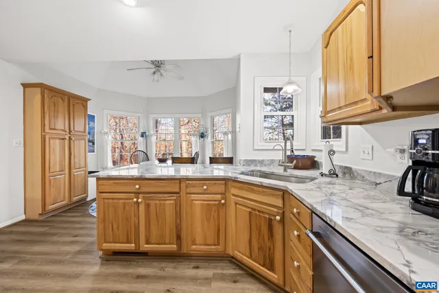a bathroom with a sink mirror toilet and shower