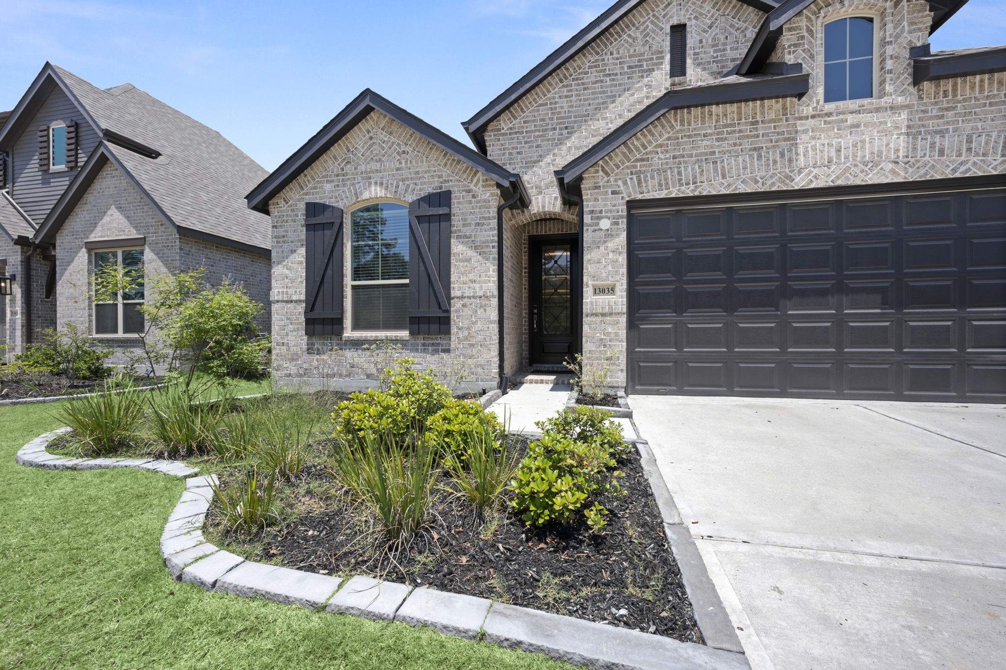 13035 Wandering Rdg Lane Conroe, TX 77302 - Photo 3 of 28 front view of a house with a yard