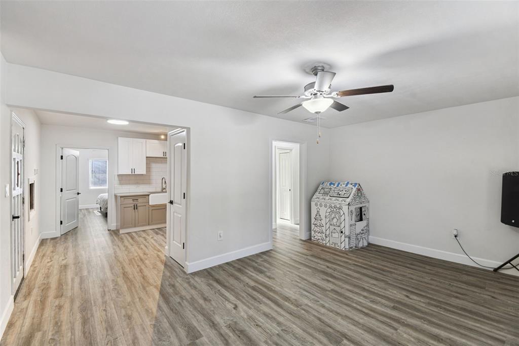 4706 Catherine Street New Port Richey, FL 34652 - Photo 12 of 45 a view of a livingroom with furniture and a ceiling fan