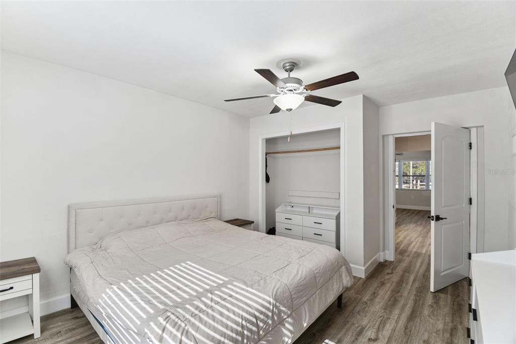 4706 Catherine Street New Port Richey, FL 34652 - Photo 19 of 45 a bedroom with a bed and a chandelier