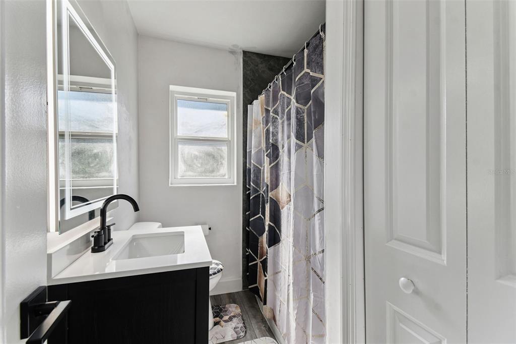 4706 Catherine Street New Port Richey, FL 34652 - Photo 24 of 45 a bathroom with a sink and a mirror