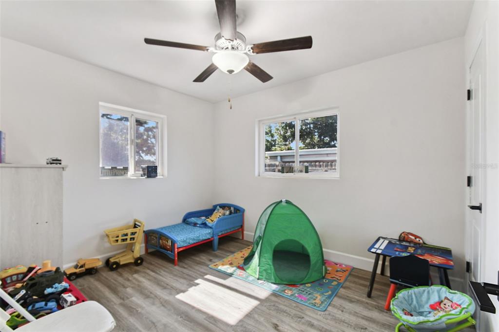4706 Catherine Street New Port Richey, FL 34652 - Photo 27 of 45 a living room with furniture and a wooden floor