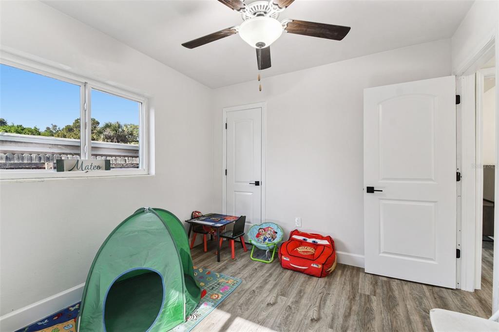 4706 Catherine Street New Port Richey, FL 34652 - Photo 28 of 45 a living room with furniture and a wooden floor