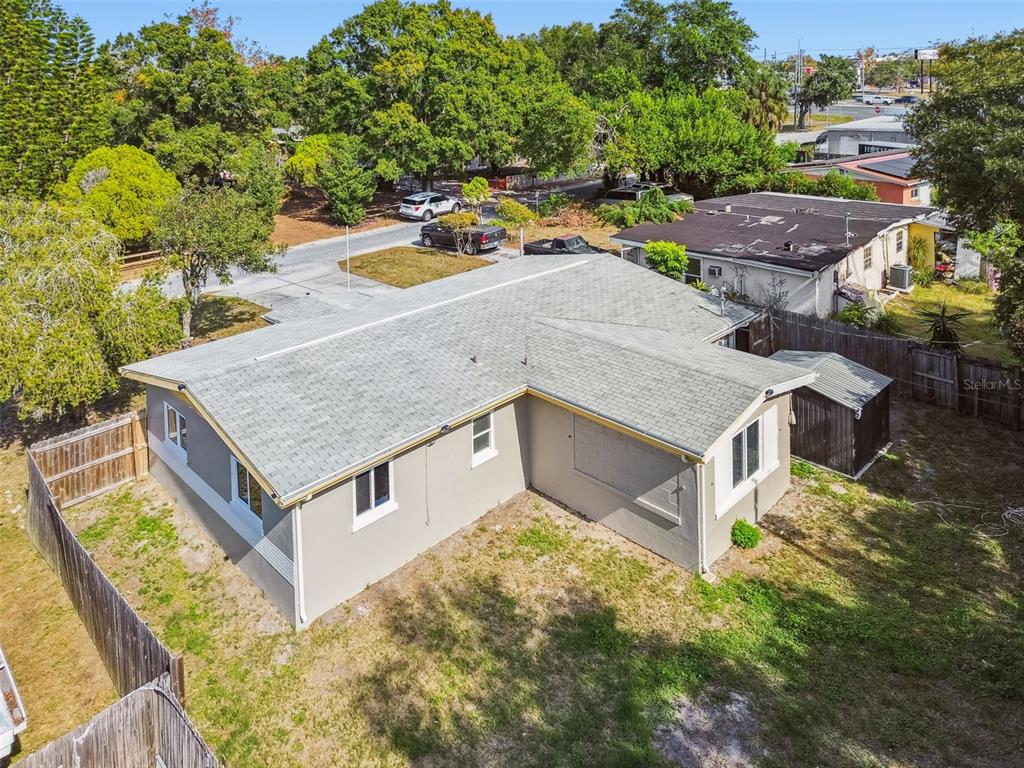 4706 Catherine Street New Port Richey, FL 34652 - Photo 29 of 45 a view of a house with a tub and a garden