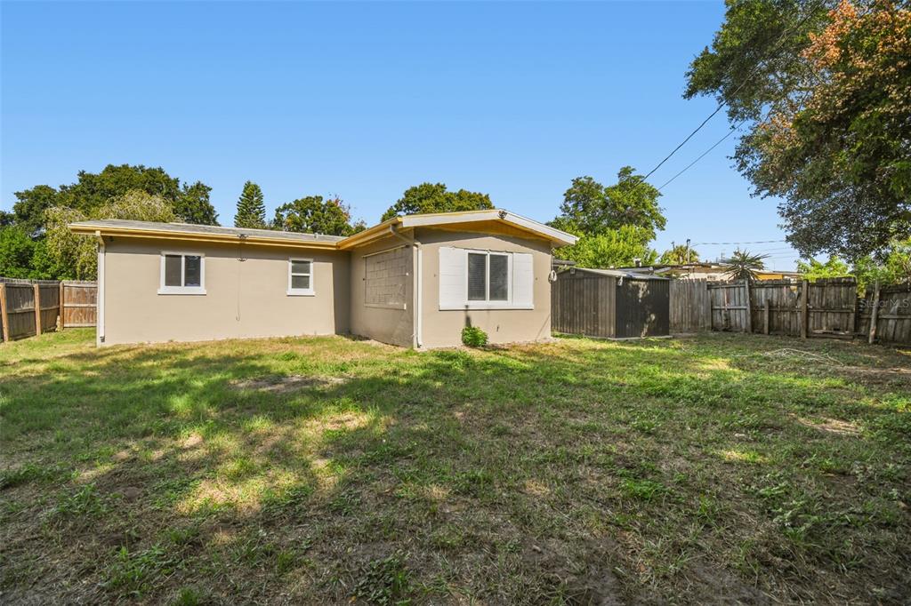 4706 Catherine Street New Port Richey, FL 34652 - Photo 30 of 45 a view of a house with a yard