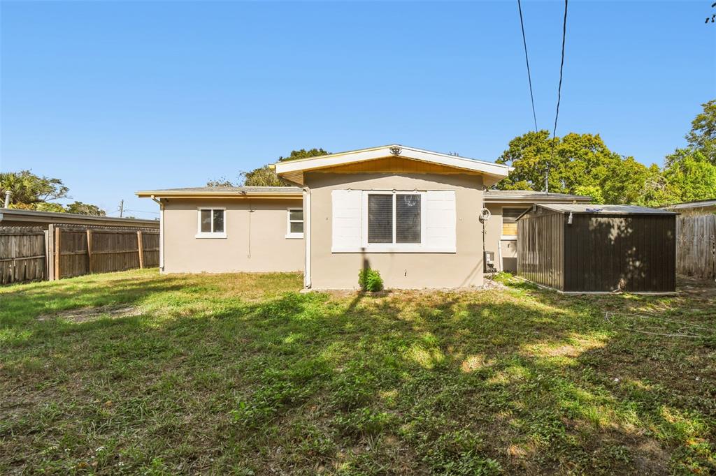 4706 Catherine Street New Port Richey, FL 34652 - Photo 31 of 45 a front view of a house with a garden