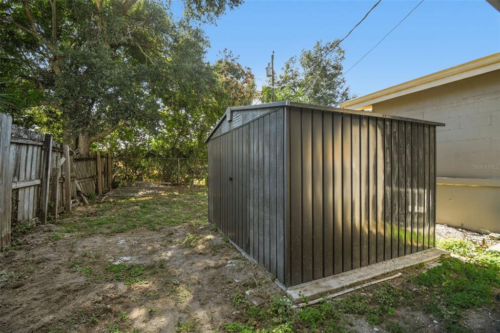 4706 Catherine Street New Port Richey, FL 34652 - Photo 32 of 45 a view of a backyard with pathway