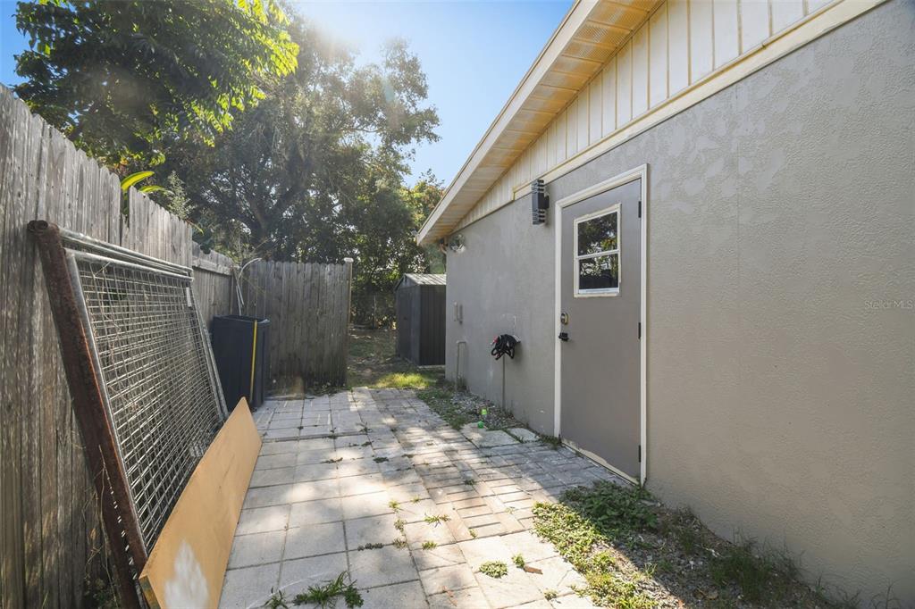 4706 Catherine Street New Port Richey, FL 34652 - Photo 33 of 45 a backyard of a house with seating space