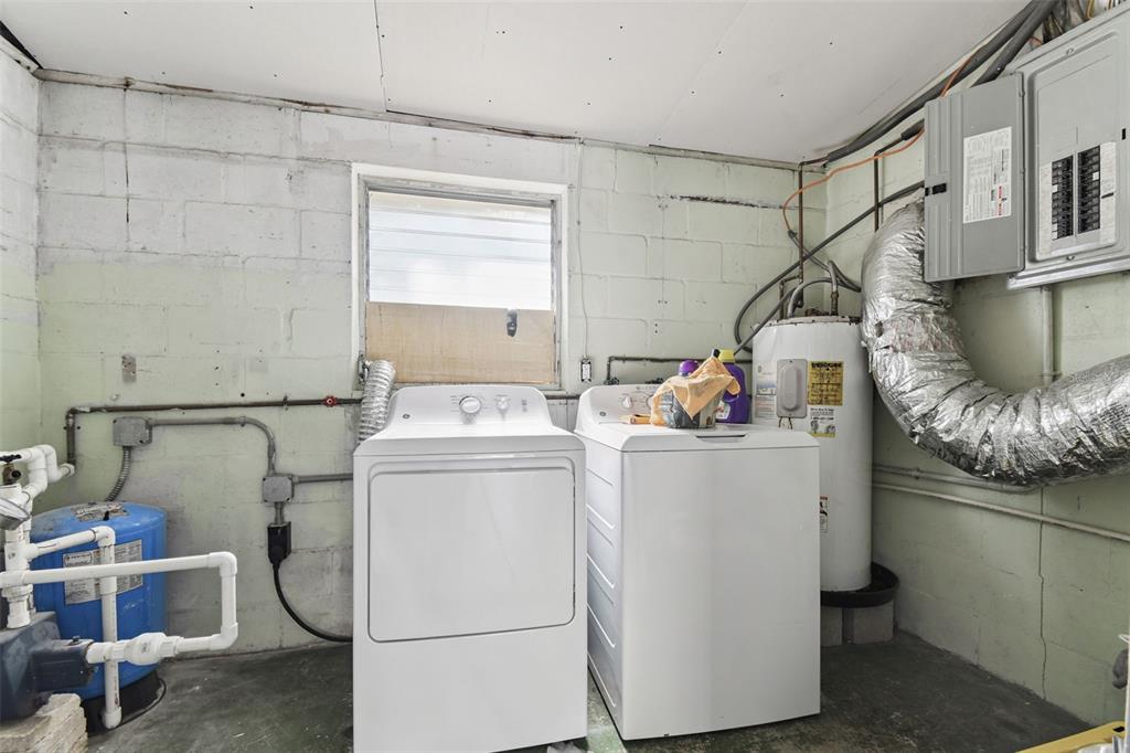 4706 Catherine Street New Port Richey, FL 34652 - Photo 35 of 45 a utility room with dryer and washer