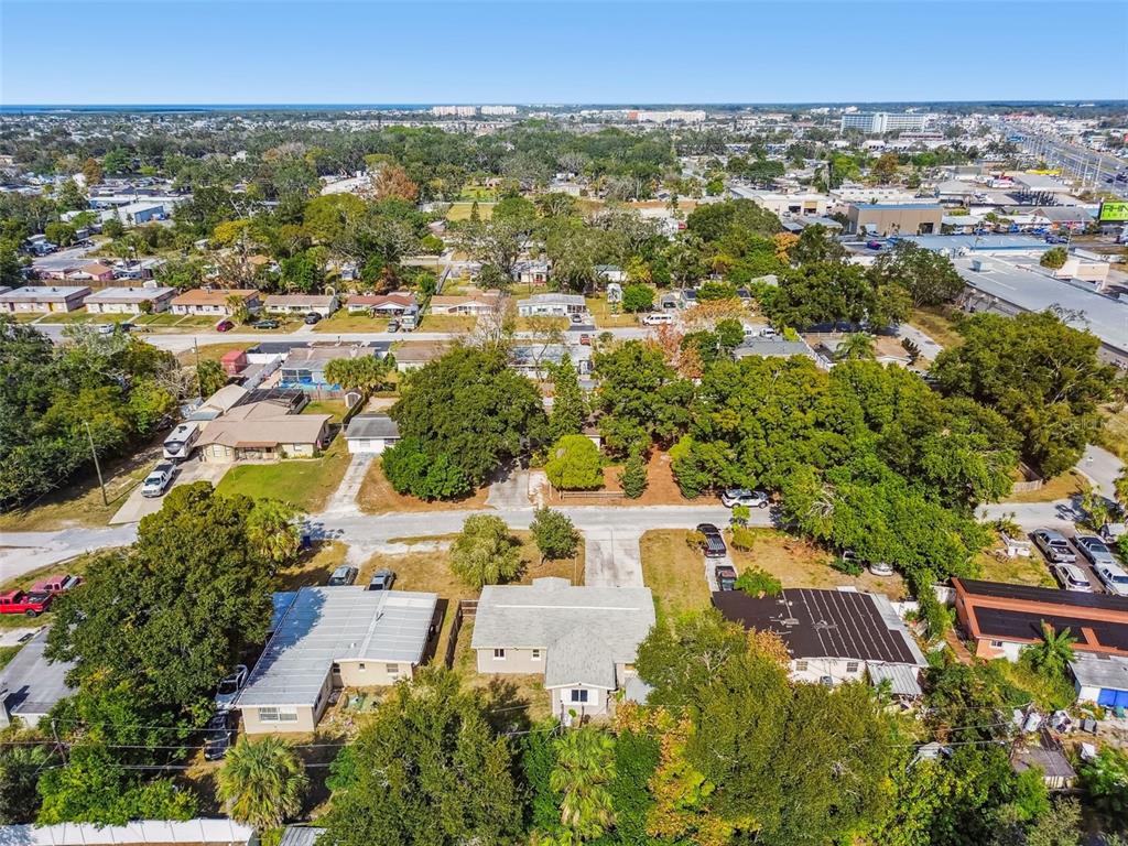 4706 Catherine Street New Port Richey, FL 34652 - Photo 42 of 45 an aerial view of residential houses with outdoor space and trees