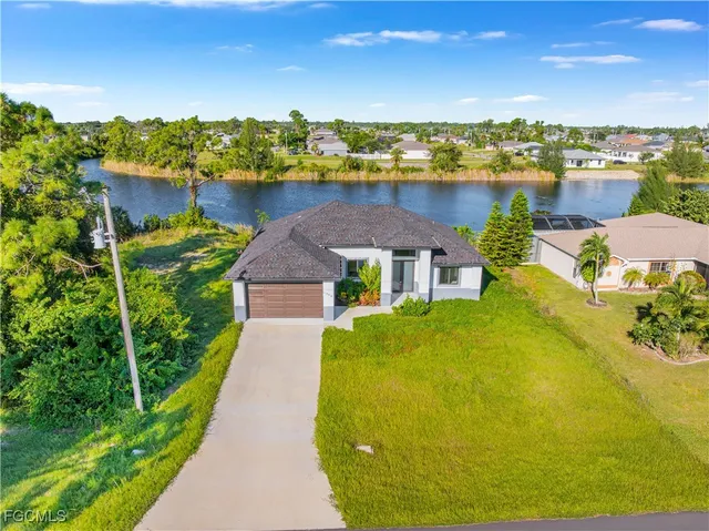 a view of a swimming pool with lounge chair