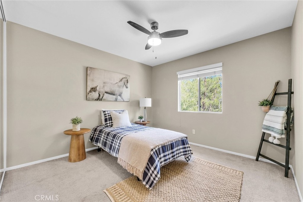 12351 Mesa Grove Drive Riverside, CA 92503 - Photo 12 of 25 a bedroom with a bed and a window