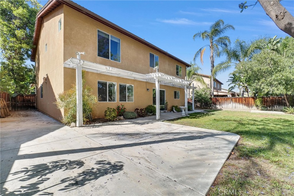 12351 Mesa Grove Drive Riverside, CA 92503 - Photo 19 of 25 a front view of a house with a yard and potted plants