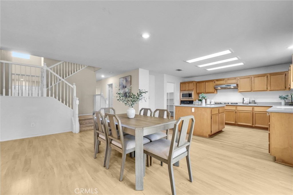 12351 Mesa Grove Drive Riverside, CA 92503 - Photo 6 of 25 a dining room with furniture and wooden floor