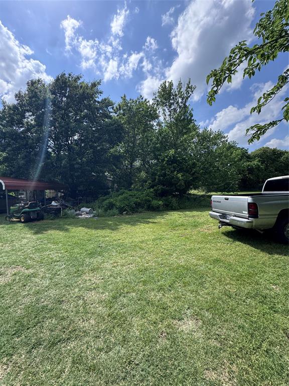 806 Old Base Road Aurora, TX 76078 - Photo 9 of 23 a view of a backyard with a garden