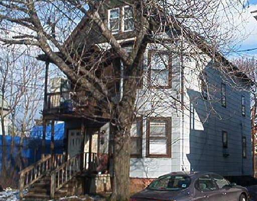 164 5th Street Bridgeport, CT 06607 - Photo 1 of 1 a front view of a house with parking area