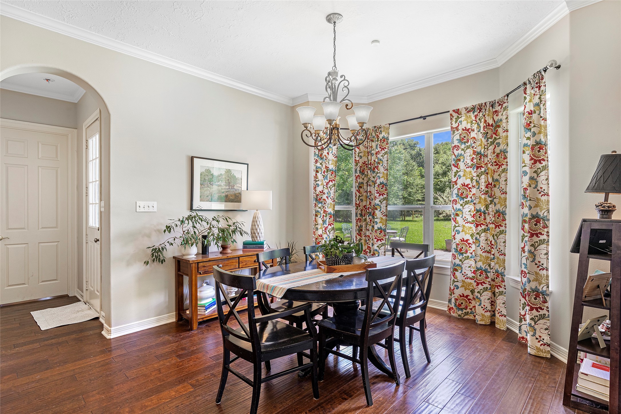 6530 Treaschwig Road, Unit 1 Spring, TX 77373 - Photo 13 of 32 a view of a dining room with furniture window and wooden floor