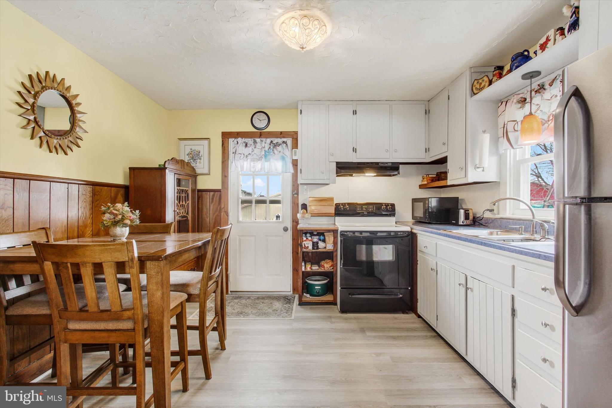371 Maple Avenue Hanover, PA 17331 - Photo 11 of 24 a kitchen with stainless steel appliances a refrigerator and a stove top oven