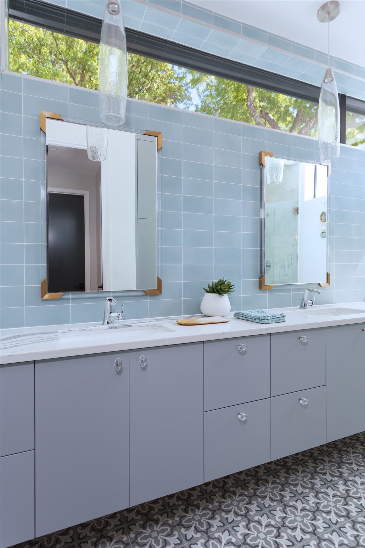 700 Jessie Street Austin, TX 78704 - Photo 20 of 40 Bathroom with double vanity, tile walls, and decorative backsplash