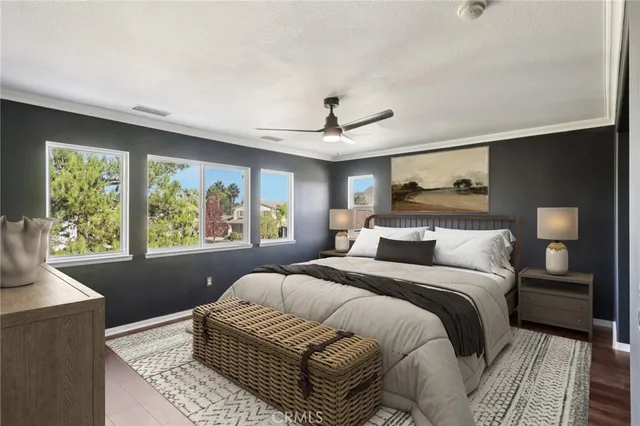 a bedroom with a large bed and a window