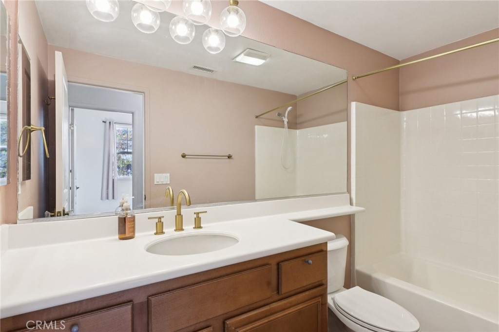29144 Lighthouse Court Menifee, CA 92585 - Photo 13 of 35 a bathroom with a sink toilet vanity and shower