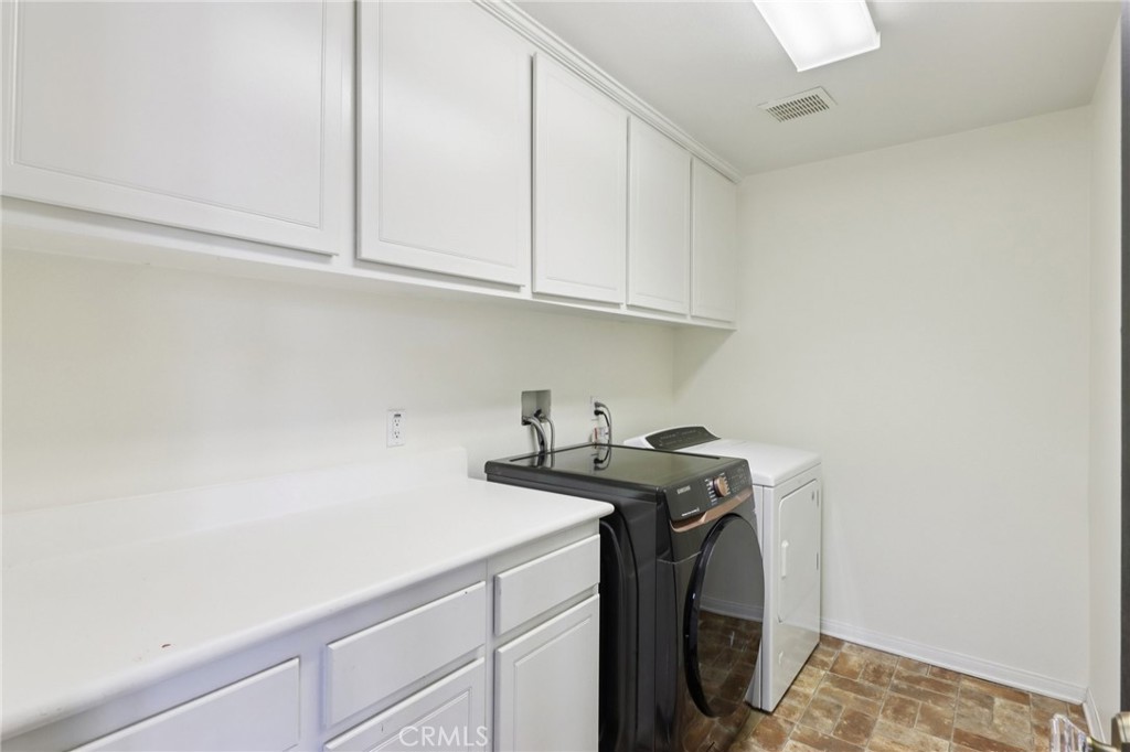29144 Lighthouse Court Menifee, CA 92585 - Photo 14 of 35 a utility room with sink dryer and washer