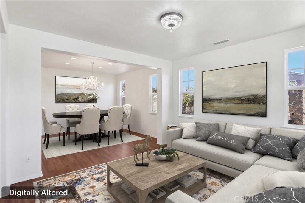 29144 Lighthouse Court Menifee, CA 92585 - Photo 3 of 35 a living room with furniture wooden floor and a table