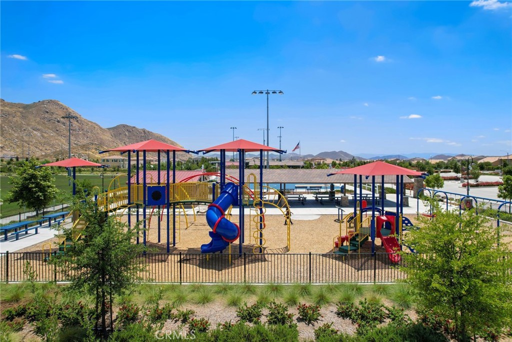 29144 Lighthouse Court Menifee, CA 92585 - Photo 32 of 35 a view of a balcony with chairs and umbrellas