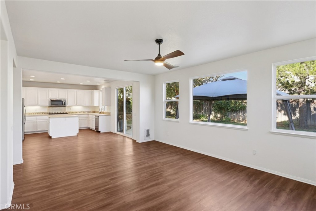 29144 Lighthouse Court Menifee, CA 92585 - Photo 8 of 35 a view of an empty room with window and wooden floor